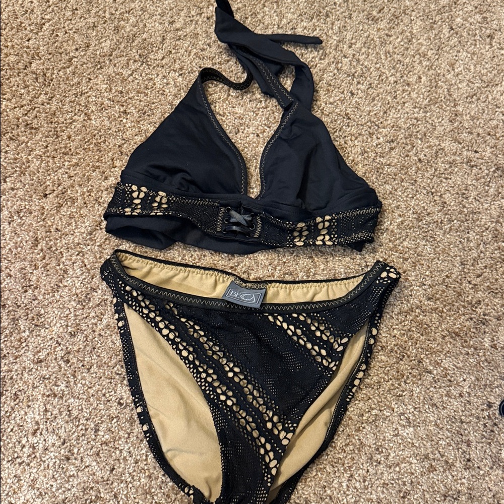 Becca black lace shoulder strap top and bikini bottom.